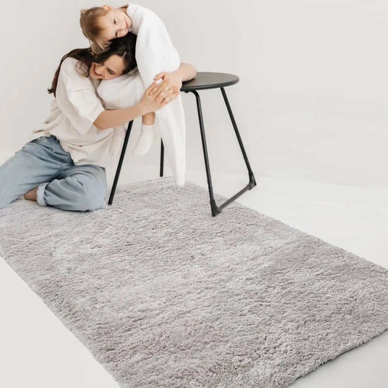 Cozy gray shaggy rug in a living room with family #color_Light Gray