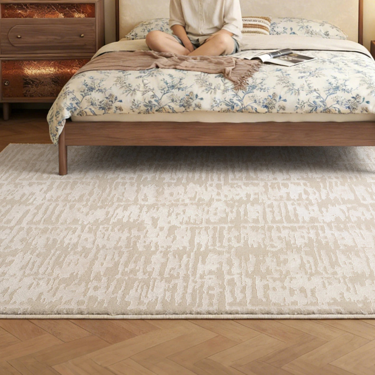 cream textured area rug placed under a bed in a cozy bedroom setting