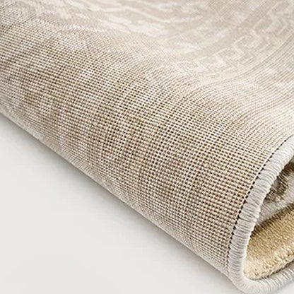 Back of a cream beige Persian area rug showing the tightly woven backing for everyday stability.