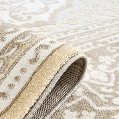 Edge binding detail of a cream beige Persian area rug showing the finished border and dense woven construction.