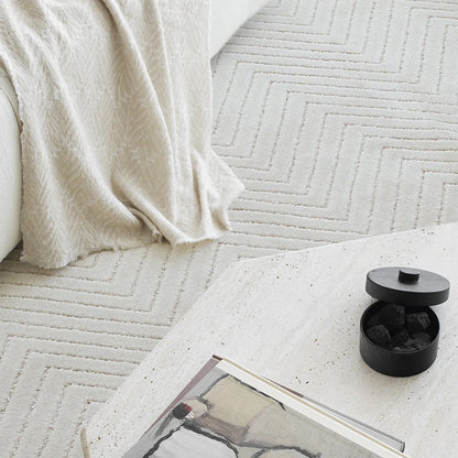 Cream chevron rug edge and surface detail with a soft thick feel and clean modern design