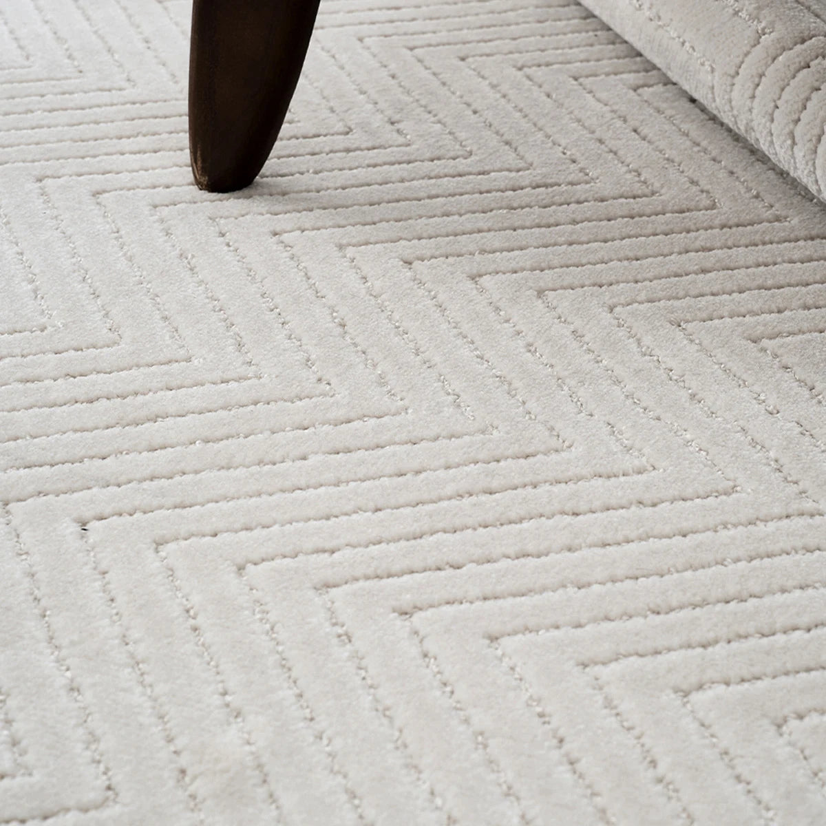 Close up of cream chevron rug texture showing a soft thick surface with dense construction