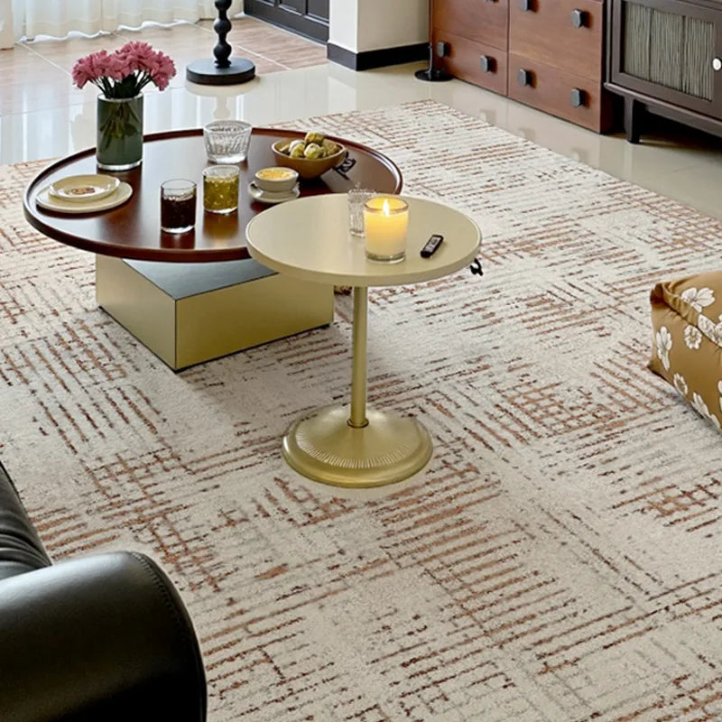 Cream Italian geometric rug in a cozy living room, paired with modern round tables and warm-toned wood accents