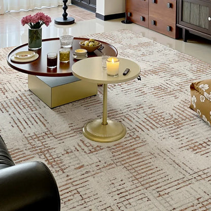 Cream Italian geometric rug in a cozy living room, paired with modern round tables and warm-toned wood accents