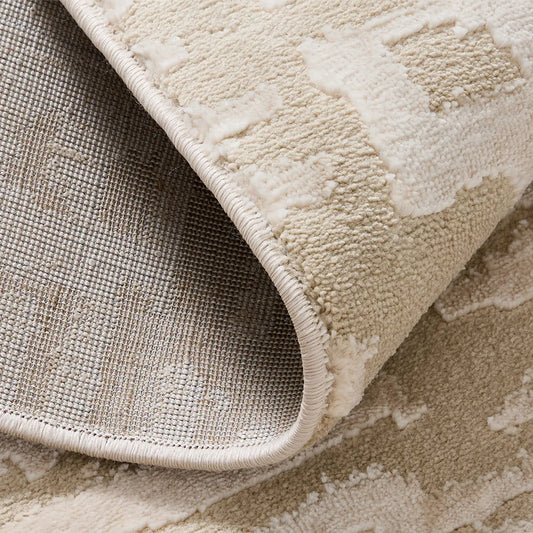 cream area rug with durable jute backing and reinforced edge detail