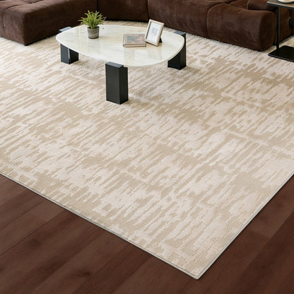 cream textured area rug under a coffee table in a modern living room with warm wood flooring