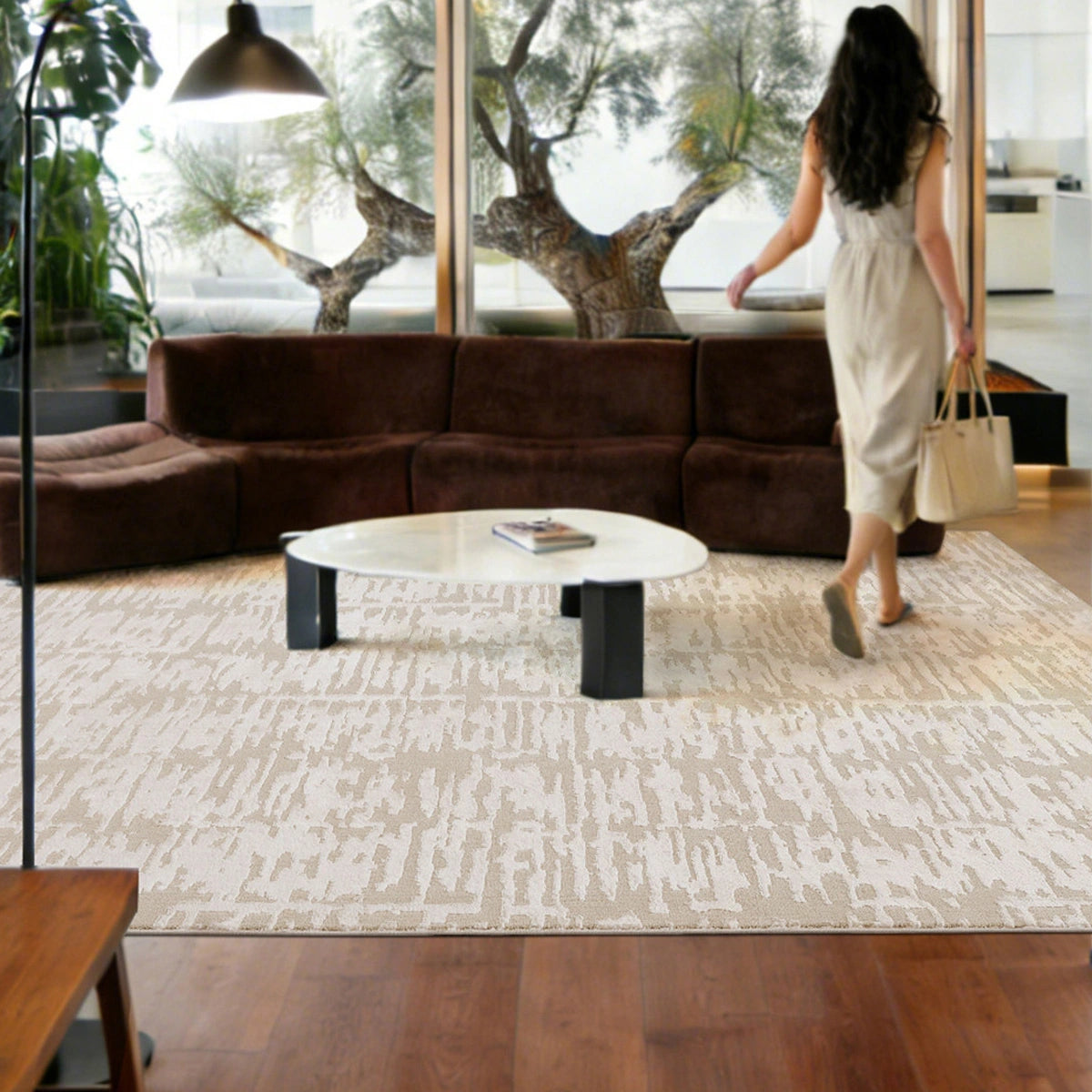 cream textured area rug in a modern living room with natural light and a clean, relaxed atmosphere