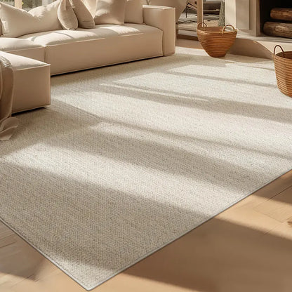 Close-up of a dense boucle-textured wool blend rug in a sunlit modern living room with cream sofa and woven baskets