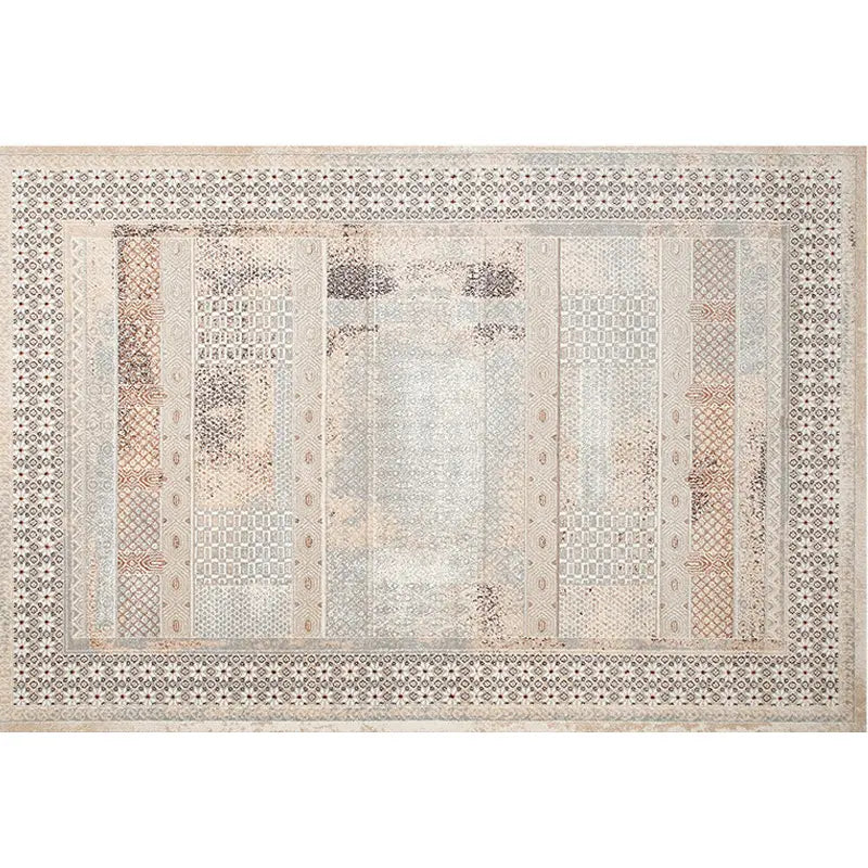 Top view of a detailed bohemian vintage rug showcasing intricate patchwork patterns and neutral tones