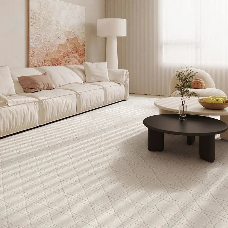 Living room with a white diamond pattern rug, cozy beige sofa, and modern coffee table under soft natural light#Texture_Crosshatch
