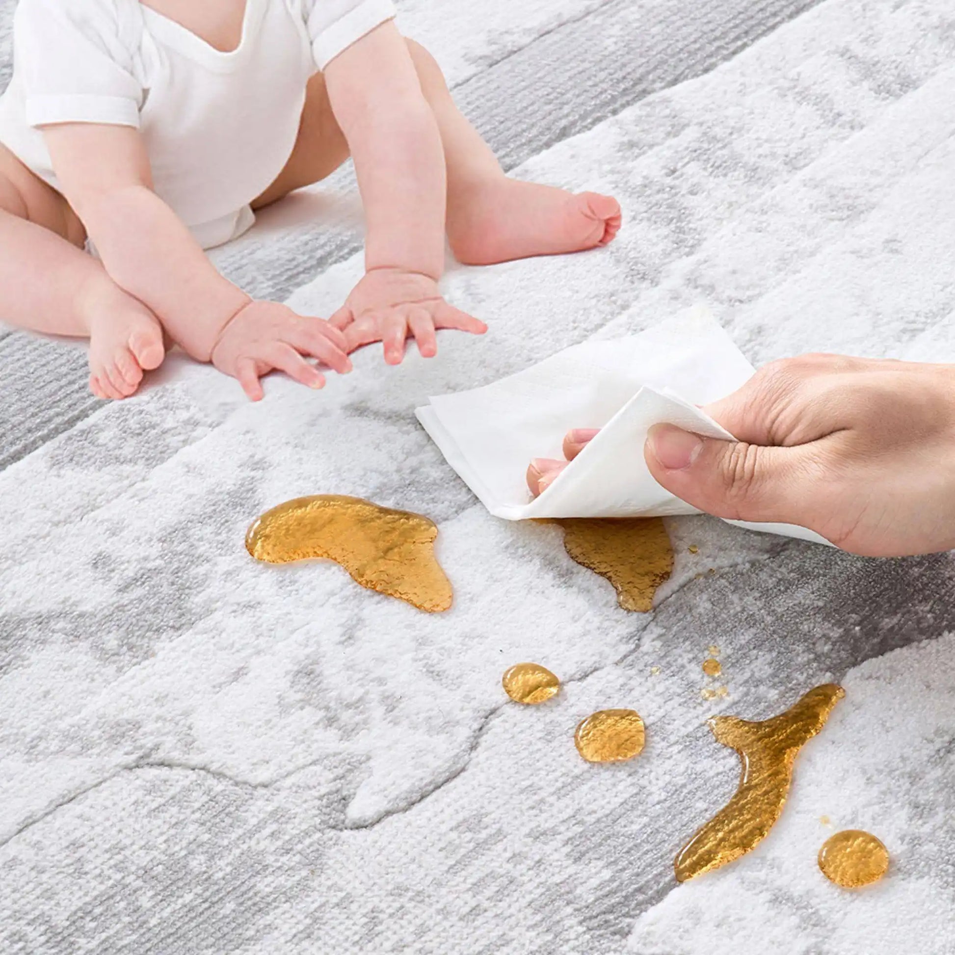 Stain resistant area rug surface showing easy cleaning of spills, suitable for living room and family use