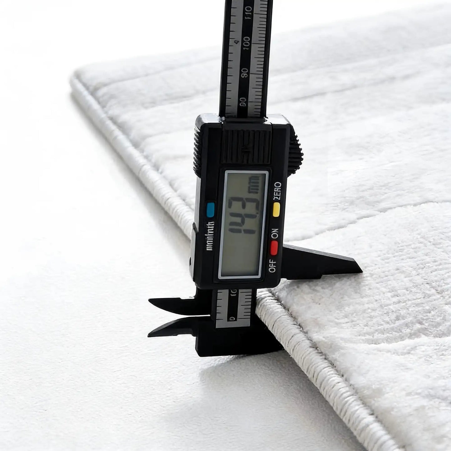 Thick cushioned area rug with dense structure measured for depth, stable on floor without rug pad