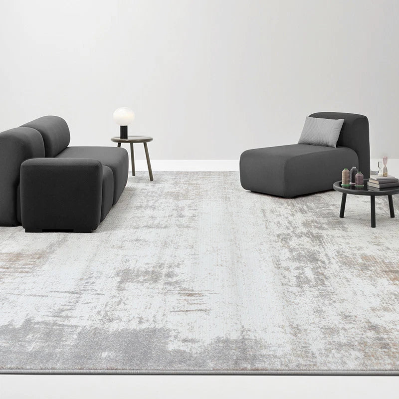 Gray abstract modern rug with subtle distressed patterns, perfect for minimalist living rooms