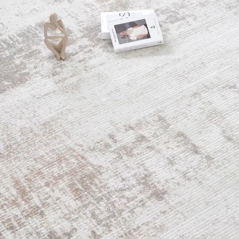 Close-up of a modern gray abstract rug with subtle texture and artistic pattern
