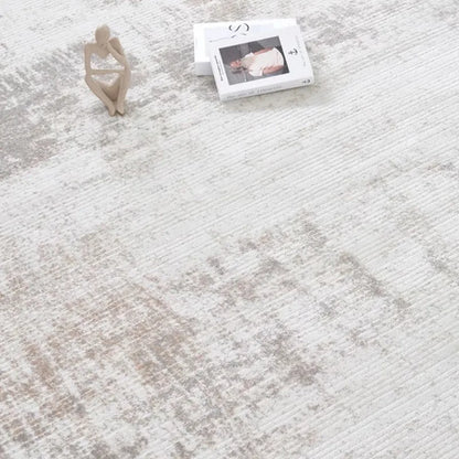 Close-up of a modern gray abstract rug with subtle texture and artistic pattern