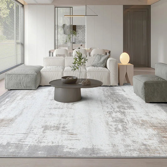 Modern gray abstract rug in a minimalist living room, enhancing the cozy and sophisticated decor