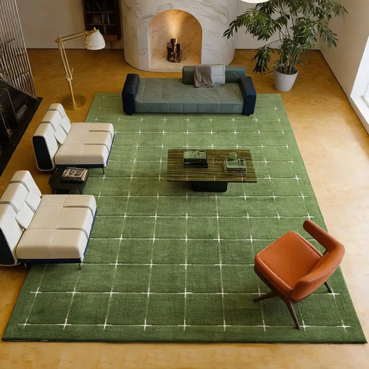 Green grid area rug in a modern living room, shown from above for scale.