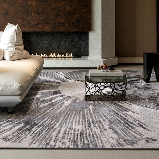 Grey abstract burst area rug in a modern living room with a fireplace and soft textured surface
