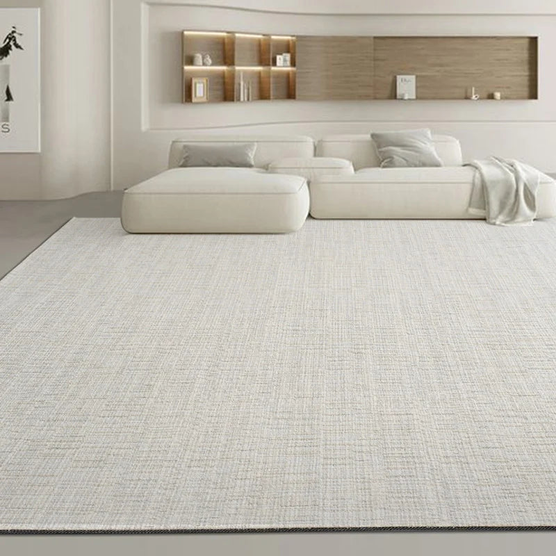 High-density flatwoven beige area rug enhancing a serene neutral-toned home interior with low-profile furniture
