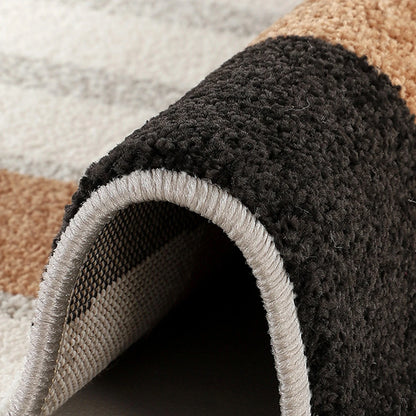 Ivory black camel geometric area rug backing and finished edge detail
