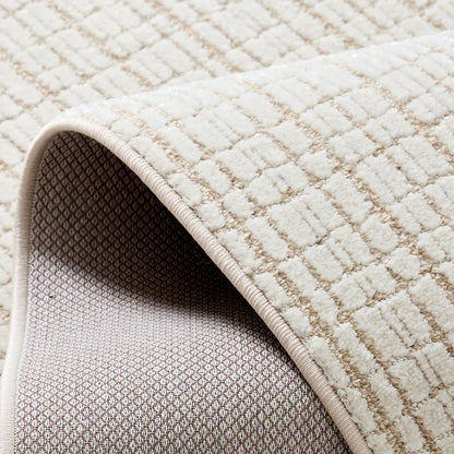 Ivory cut and loop grid area rug showing cotton backing and reinforced edge binding
