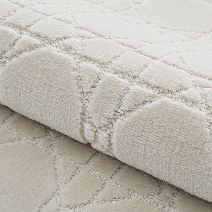 Ivory high-low geometric rug detail showing soft raised texture and thick woven construction
