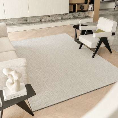 Ivory gray linear textured area rug styled in a modern living room with neutral furniture