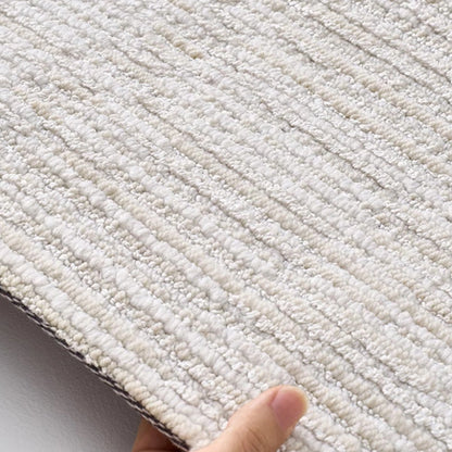 Ivory gray linear textured area rug edge detail showing dense woven construction and low pile surface