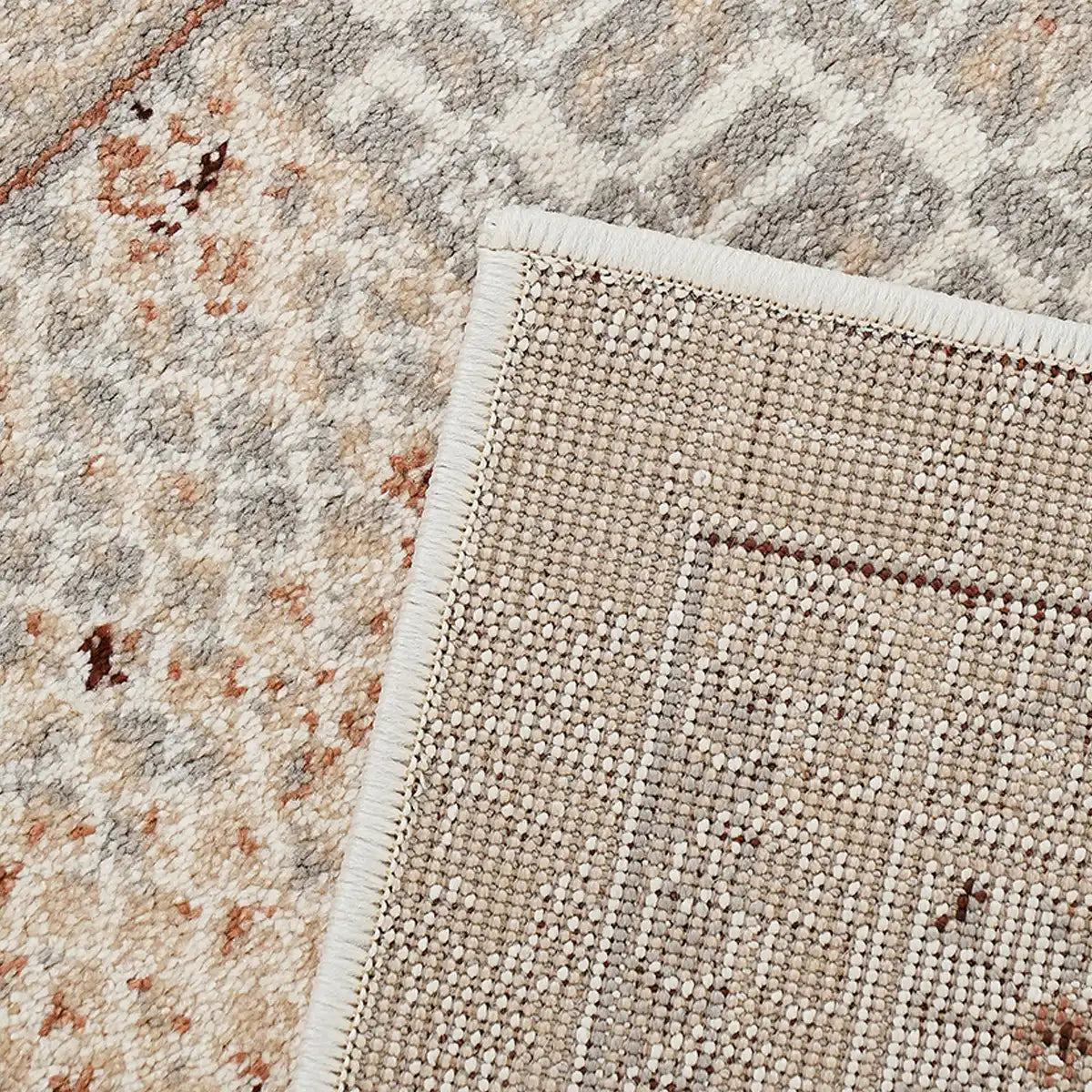 Ivory gray rust vintage area rug backing detail with finished edge and woven construction
