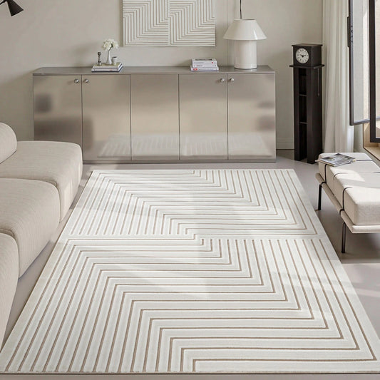 Ivory taupe high low geometric line area rug styled in a calm modern living room
