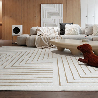 Ivory taupe high low geometric area rug styled with a neutral sofa in a modern living room