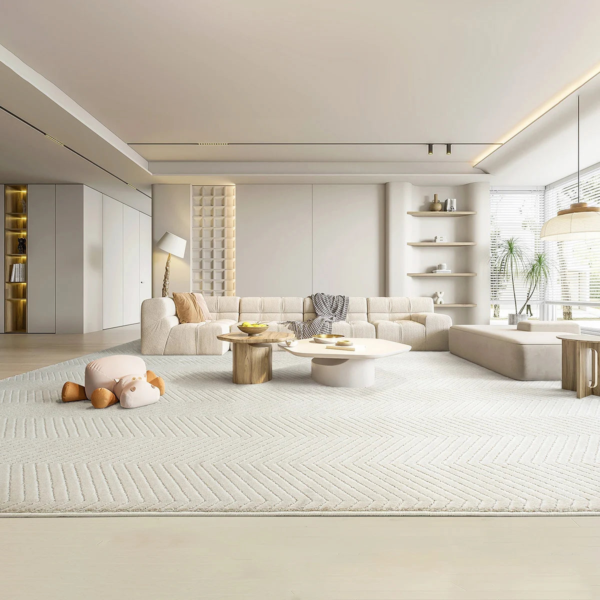 Large cream chevron area rug in an open living space, soft underfoot and thick with no rug pad needed