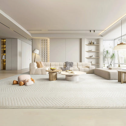 Large cream chevron area rug in an open living space, soft underfoot and thick with no rug pad needed