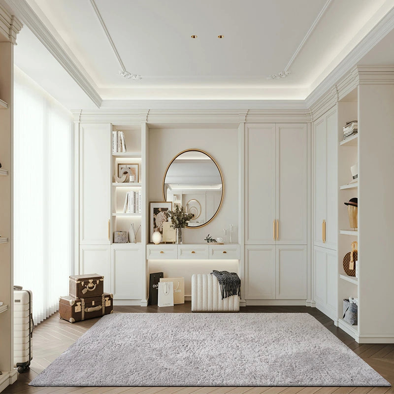 Light gray shaggy rug in a classic white bedroom with gold accents and elegant decor #color_Light Gray