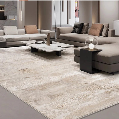 large beige living room rug with soft texture in a modern space, paired with gray sofas and a marble coffee table