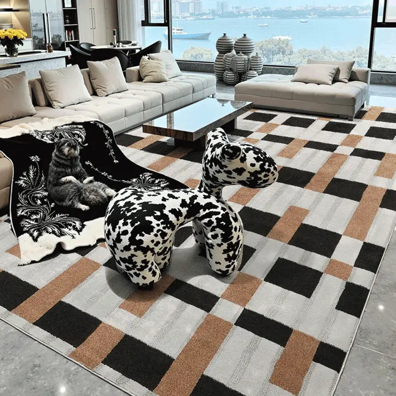 Modern luxury living room featuring a geometric checkered rug in black, beige, and brown tones with artistic decor and sea view