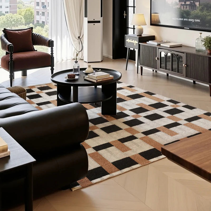 Modern living room with a bold checkered block rug in black, brown, and ivory tones under round black coffee table
