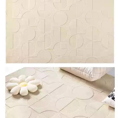 Modern cream rug with circle motifs styled in a cozy living space, highlighting embossed detailing