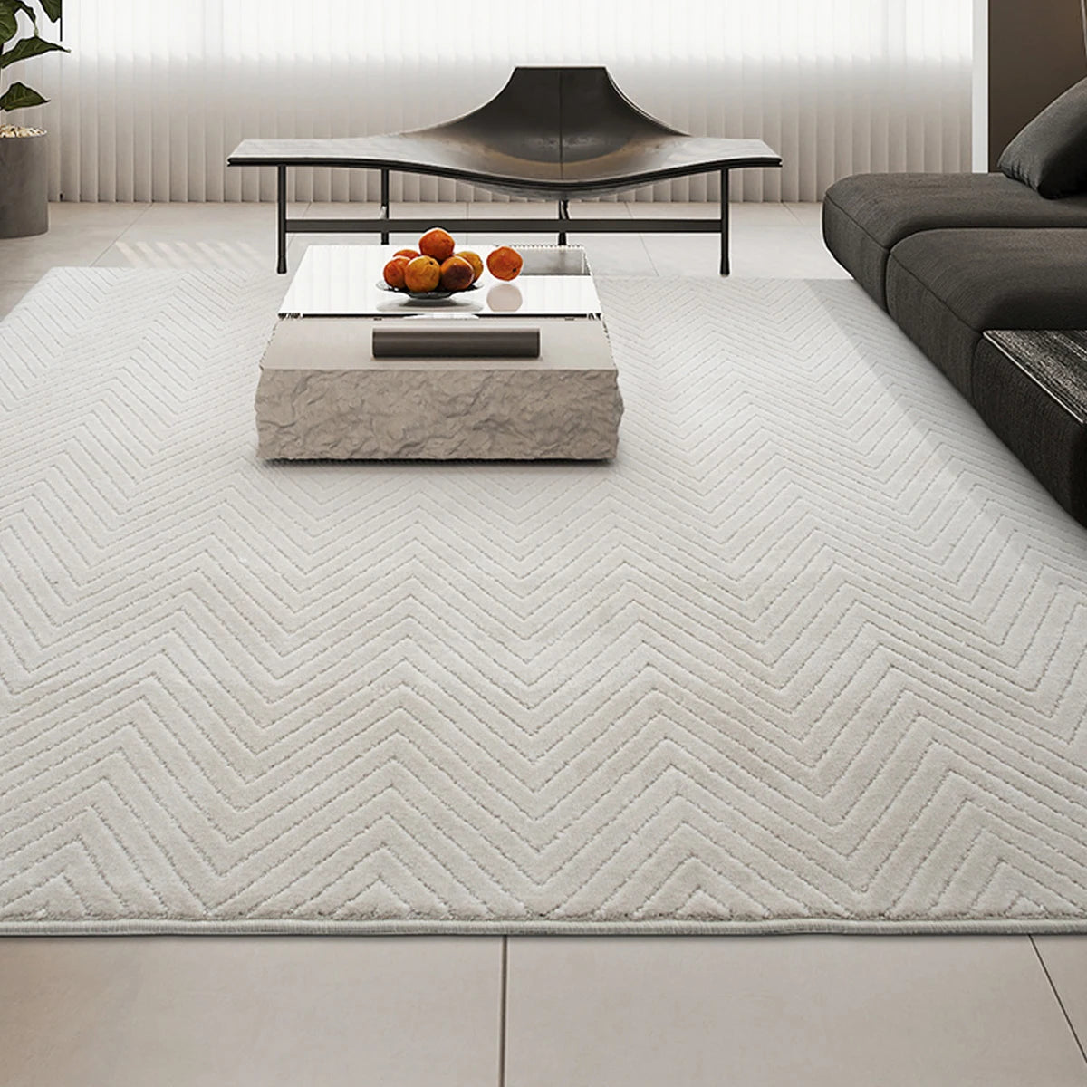 Modern cream chevron living room rug paired with dark furniture, thick construction and stable without a rug pad