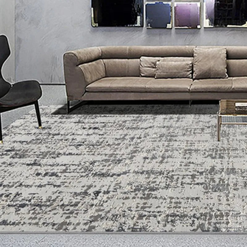 Stylish gray area rug in a modern living room with a beige sofa and contemporary decor