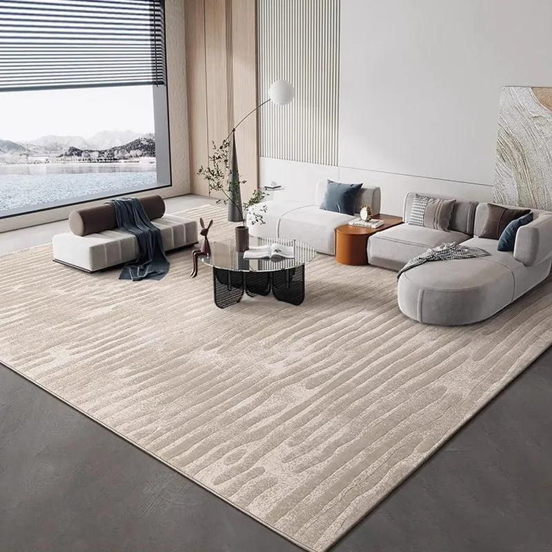 Modern spacious living room with large beige abstract wave-pattern rug, contemporary furniture, panoramic window, and minimalist decor
