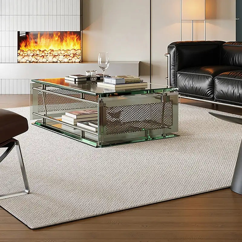 Minimalist wool rug in a modern living room with a glass coffee table and fireplace.