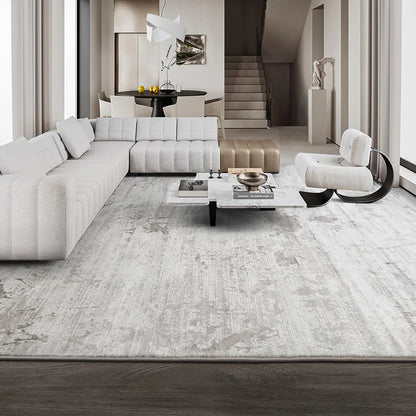 Modern living room featuring a sleek abstract rug, a sectional sofa, and minimalist decor #color_gray
