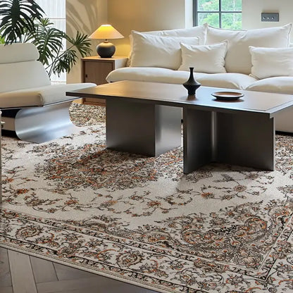 Modern Persian-style area rug in a cozy white sofa living room, featuring a soft washable surface, vintage floral design, and eco-friendly glue-free backing.