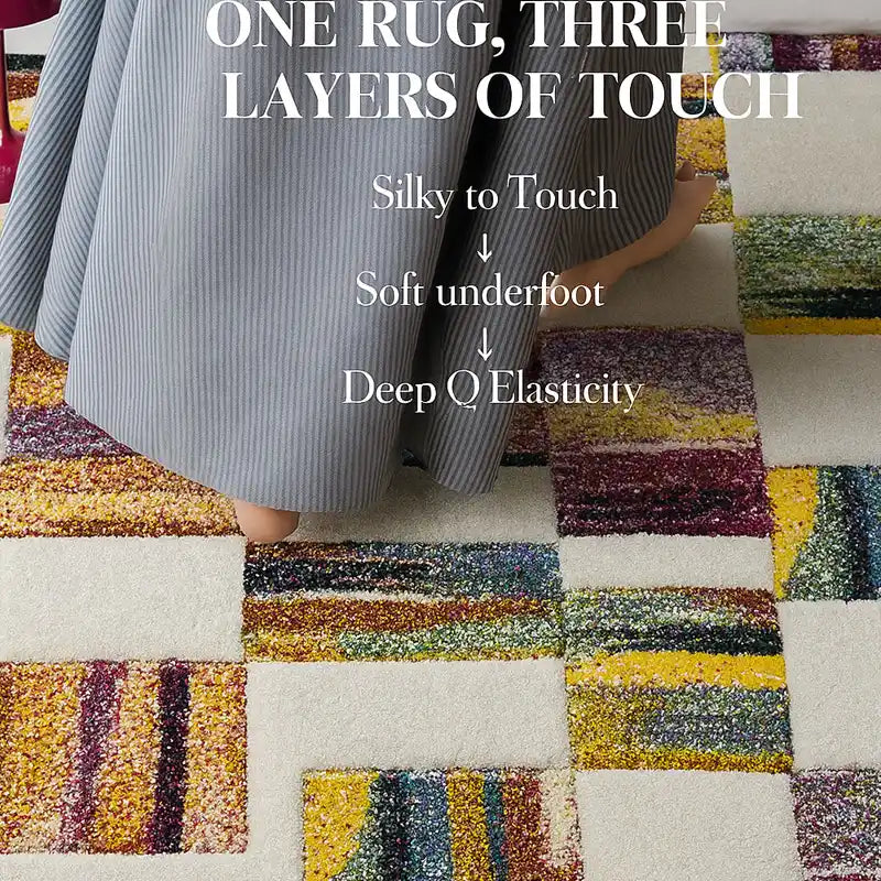Close-up of a multicolor textured rug with layered touch feel, showing foot pressing on soft surface