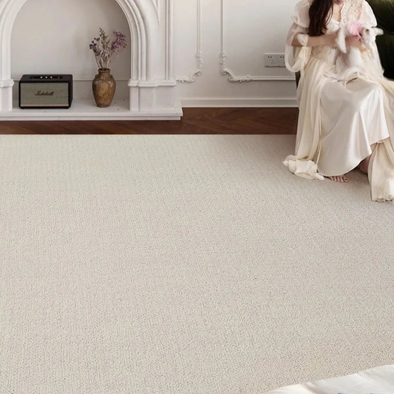 atural wool loop pile area rug with cozy texture and neutral tones in a minimalist living room