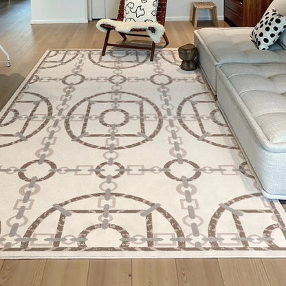 Neutral chain motif rug paired with beige sofa and accent armchair in a minimalist interior