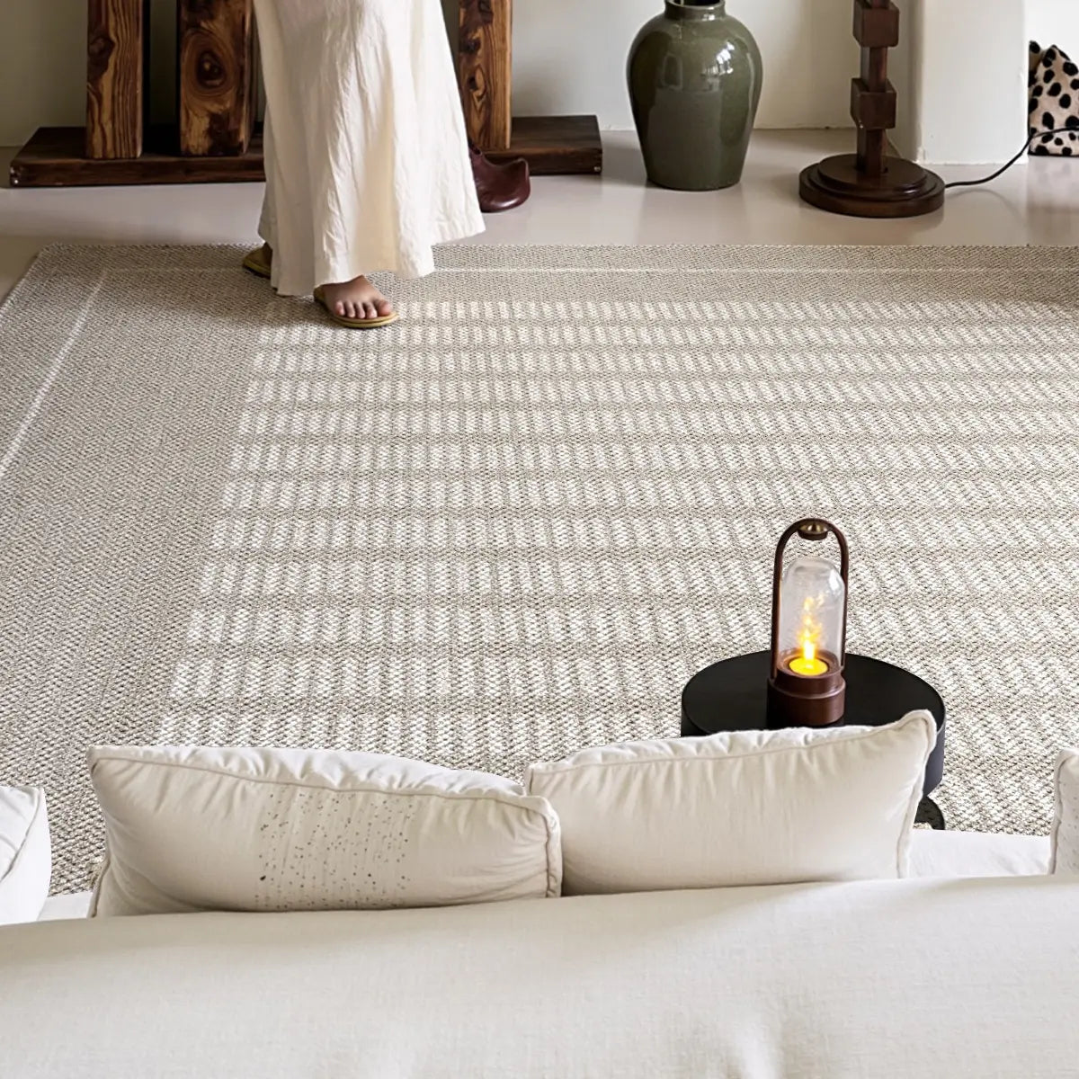 Neutral geometric area rug with a thick woven construction and calm minimalist style