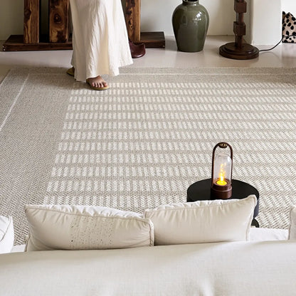 Neutral geometric area rug with a thick woven construction and calm minimalist style