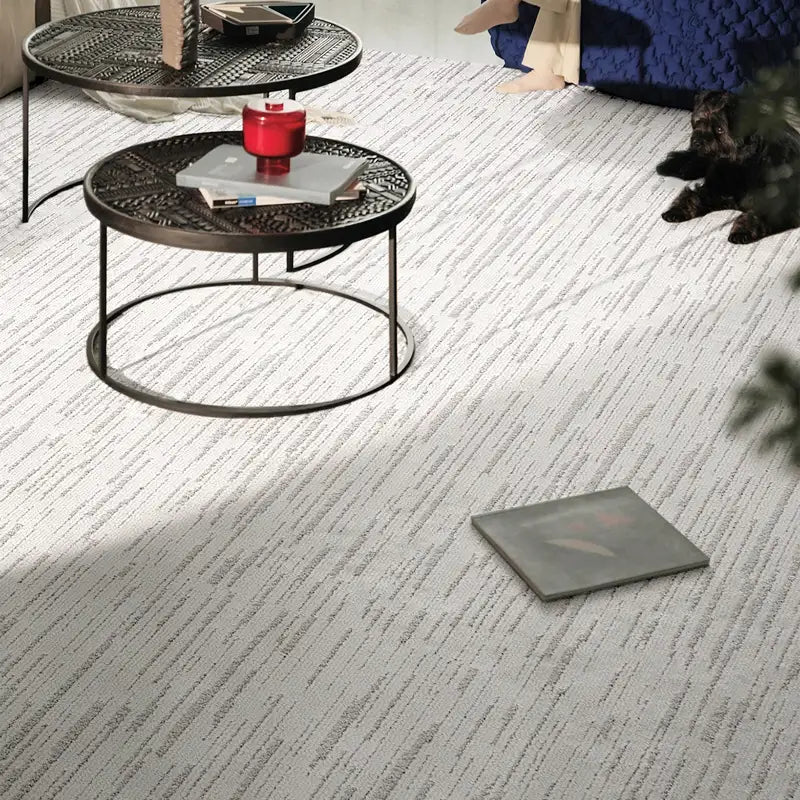 Neutral striped rug with a soft woven texture, enhancing a modern living room setting #Texture_Stripe